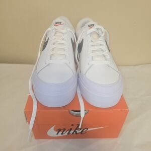 Nike White Platform Sneakers with Black Swoosh